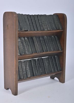 a wooden book shelf with a lot of books on it