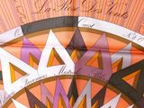 an open book with a picture of a colorful design on it