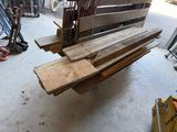 several pieces of wood are stacked on top of each other in a garage