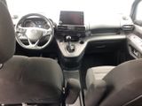 the interior of a car with a steering wheel, dashboard, and dashboard controls