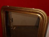 a mirror that is sitting on the floor in a room