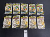 six packs of pokemon trading cards sitting on a table
