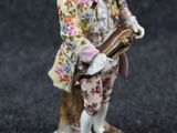 an image of a figurine of a man with a guitar