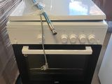 stove with a white top and a black bottom with a blue handle