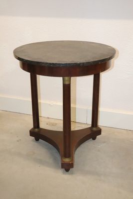 an image of a round table with a marble top