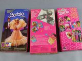 three barbie dolls are lined up in a row on a table