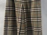 a close up of a skirt on a hanger on a white background