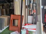 a pile of assorted items on the floor in the garage