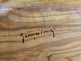 a close up of a piece of wood with writing on it