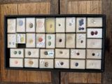 a picture of a display case with buttons and magnets