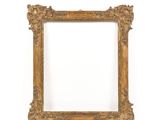 a gold frame with a white background and a white wall