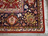 a rug on the floor with a red and blue design