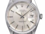 une photo d'une montre Rolex en acier inoxydable avec un cadran blanc