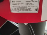 a red machine that is sitting on a table