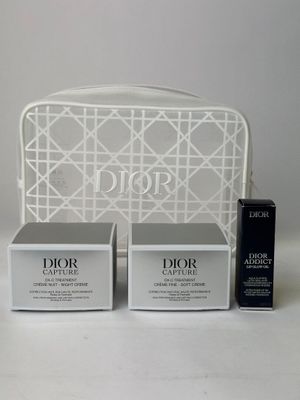 two boxes of dior beauty products sitting on a white table