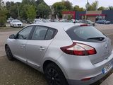 a silver car parked on the side of the road