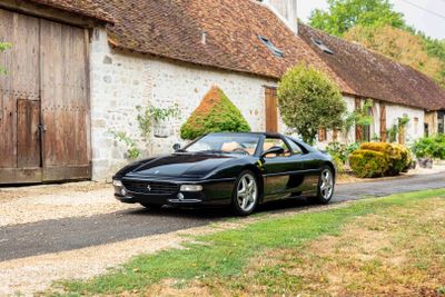 a black sports car parked on the side of the road
