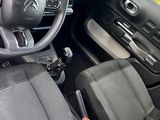 the interior of a small car with a steering wheel and dashboard