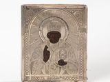 an antique silver plate with a picture of a man holding a baby