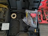 a box with tools in it sitting on the floor