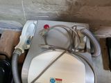 an image of a toilet with a hose attached to it