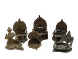 several different types of metal items are displayed on a white surface