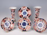 several different types of decorative vases and plates on a white surface