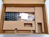 a box with a remote and a charger inside of it