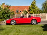a red sports car parked on the side of the road