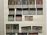 a picture of a display of stamps in a glass case