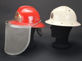 pair of red and white hard hats on a black mannequin head
