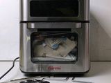 a toaster oven that has a bunch of items inside of it