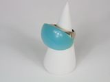 a white cone with a blue ring on top of it