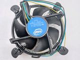 a cpu fan with wires attached to it on a white surface