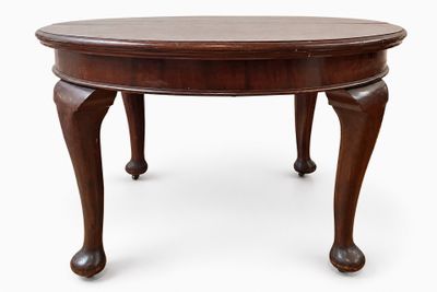 an image of a wooden table with two legs and a round top