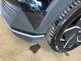 a close up of a car tire on the ground