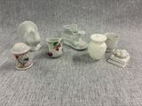 a group of porcelain objects sitting on a table