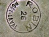 a close up of a stamp on the side of a building