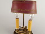 an image of a table lamp with a red shade on top of it