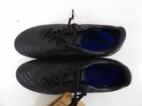 pair of black leather shoes with blue soles on a white surface