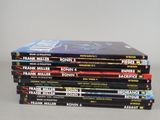 six books stacked on top of each other on a table