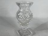 a clear glass vase sitting on top of a table
