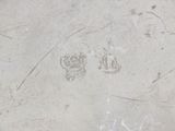 a close up of a drawing of a skull on a cement surface