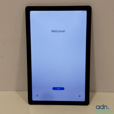 a tablet computer sitting on top of a table next to a wall