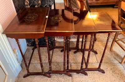 a table with four chairs and a table with a vase on it