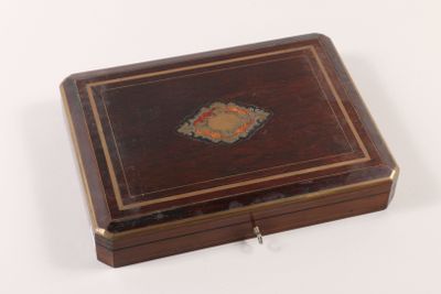 a small wooden box with a decorative design on it