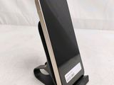 a cell phone that is sitting on a stand
