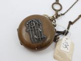 a locke with a bird on it and a tag on it