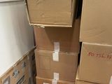many boxes stacked on top of each other on the floor