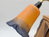 a lamp that is sitting on top of a wooden table